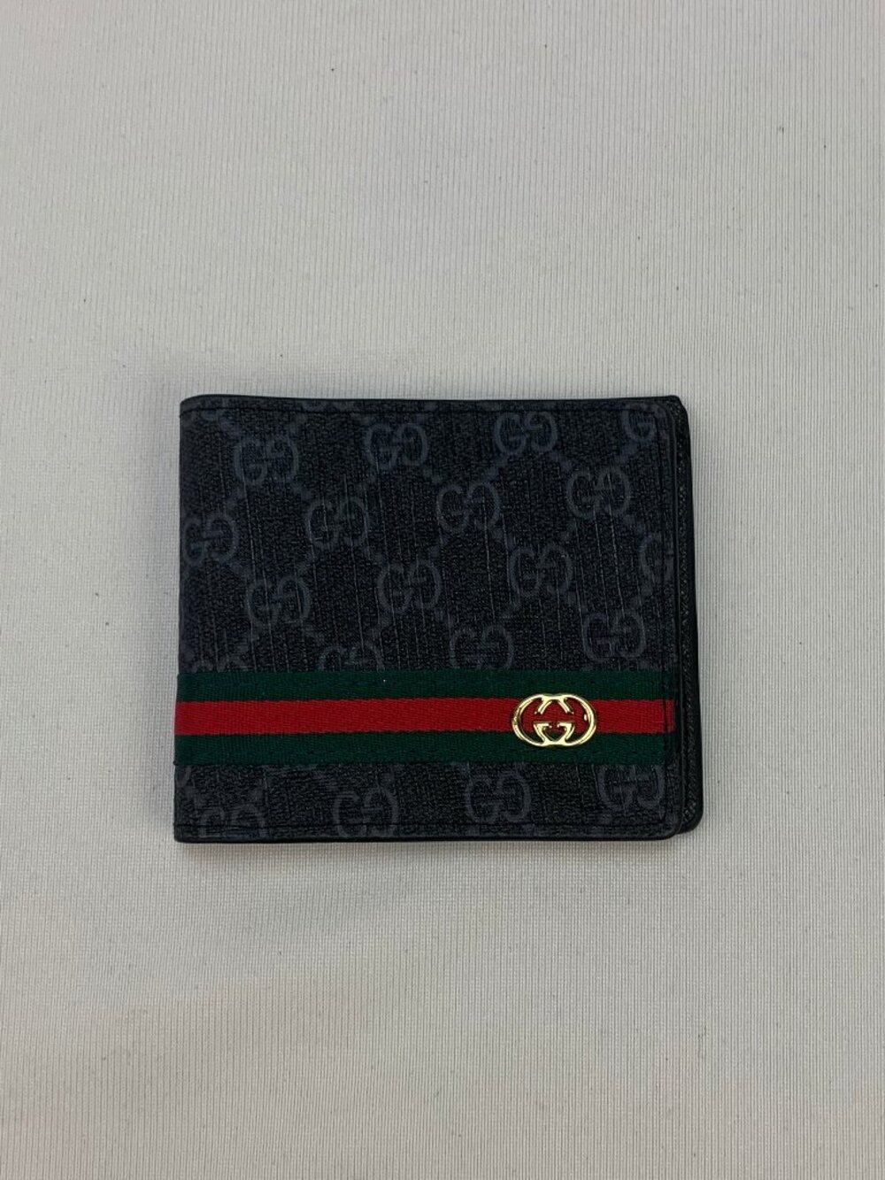 Gucci black wallet with GG pattern